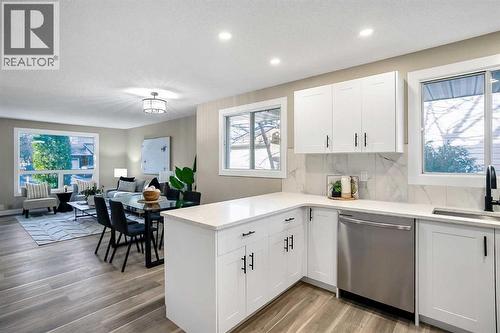 Kitchen has been updated with timeless white shaker cabinets, brand new stainless steel appliances & quartz counters - 467 Berkley Crescent Nw, Calgary, AB - Indoor