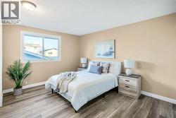 The large master bedroom can easily accommodate king-sized furniture, has a large closet & a updated 2pc ensuite - 