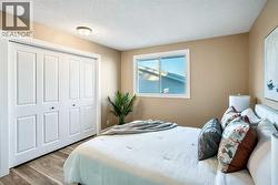 The large master bedroom can easily accommodate king-sized furniture, has a large closet & a updated 2pc ensuite - 