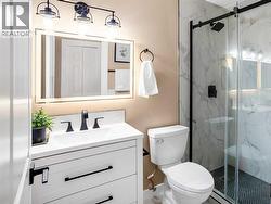 Updated main floor bathroom comes complete with a gorgeous tile surround shower with 10mm glass - 