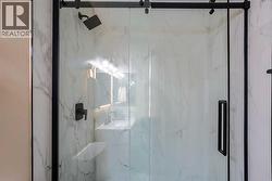 Updated main floor bathroom comes complete with a gorgeous tile surround shower with 10mm glass - 