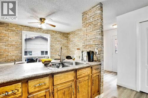 48 Templeridge Crescent Ne, Calgary, AB - Indoor Photo Showing Kitchen With Double Sink