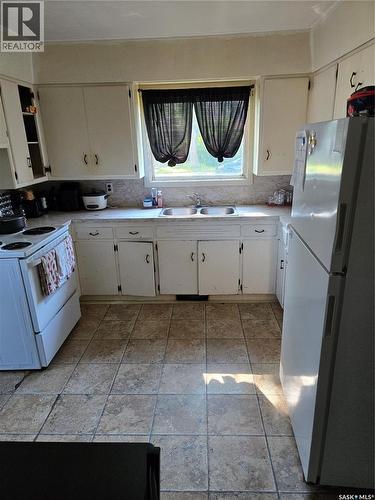 701 3Rd Street, Estevan, SK - Indoor Photo Showing Kitchen With Double Sink