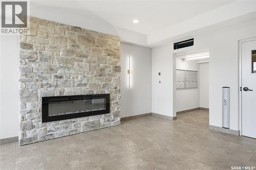 1203 101 Secord Way, Saskatoon, SK - Indoor Photo Showing Living Room With Fireplace