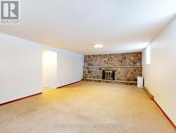 Family Room with wall to wall stone fireplace. - 