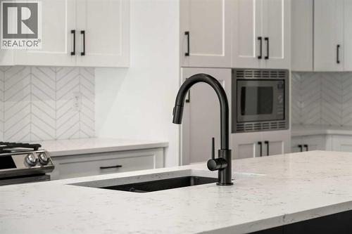 40 West Grove Link Sw, Calgary, AB - Indoor Photo Showing Kitchen With Upgraded Kitchen