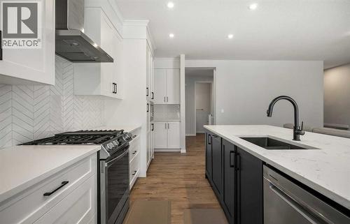 40 West Grove Link Sw, Calgary, AB - Indoor Photo Showing Kitchen With Upgraded Kitchen