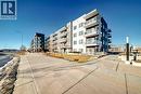 409, 4150 Seton Drive Se, Calgary, AB  - Outdoor With Balcony With Facade 