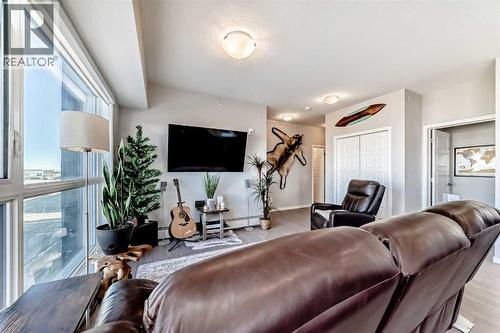 409, 4150 Seton Drive Se, Calgary, AB - Indoor Photo Showing Living Room