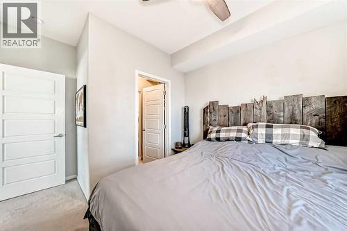 409, 4150 Seton Drive Se, Calgary, AB - Indoor Photo Showing Bedroom