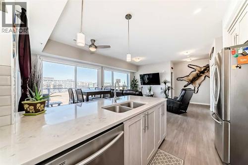 409, 4150 Seton Drive Se, Calgary, AB - Indoor Photo Showing Kitchen With Double Sink With Upgraded Kitchen