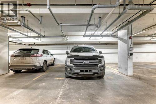409, 4150 Seton Drive Se, Calgary, AB - Indoor Photo Showing Garage