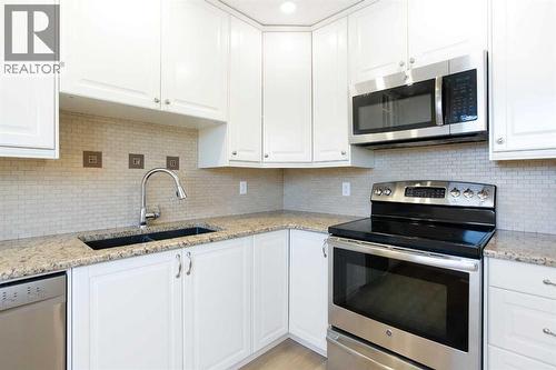 14668 Deer Run Drive Se, Calgary, AB - Indoor Photo Showing Kitchen With Double Sink With Upgraded Kitchen