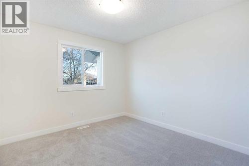 Bedroom #3 - upstairs - 14668 Deer Run Drive Se, Calgary, AB - Indoor Photo Showing Other Room