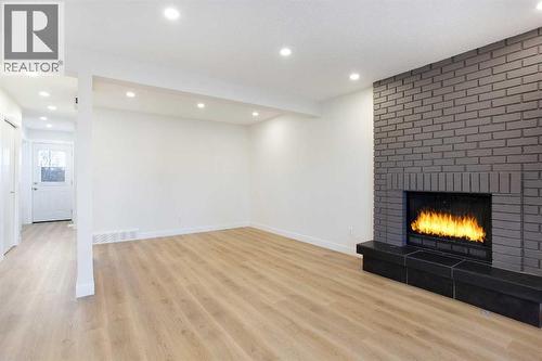 Living/Dining - 14668 Deer Run Drive Se, Calgary, AB - Indoor With Fireplace