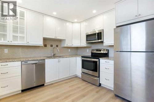 14668 Deer Run Drive Se, Calgary, AB - Indoor Photo Showing Kitchen With Upgraded Kitchen