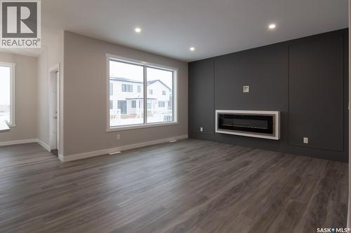 203 Sharma Lane, Saskatoon, SK - Indoor Photo Showing Living Room With Fireplace