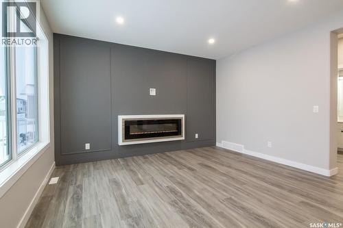 203 Sharma Lane, Saskatoon, SK - Indoor Photo Showing Living Room With Fireplace