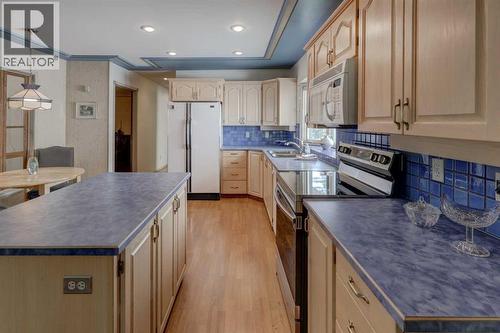 76 Edgeland Road Nw, Calgary, AB - Indoor Photo Showing Kitchen With Double Sink