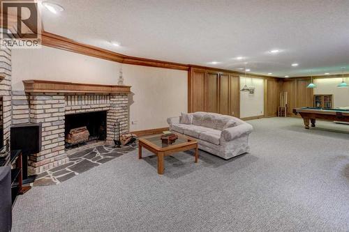 76 Edgeland Road Nw, Calgary, AB - Indoor Photo Showing Other Room With Fireplace