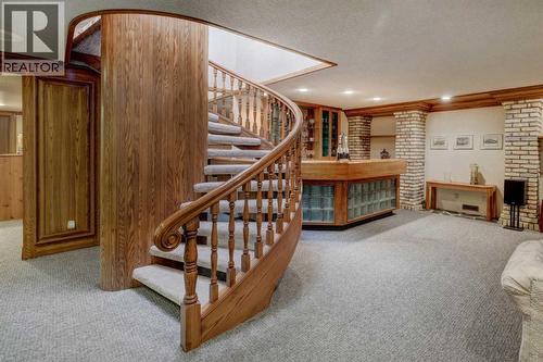 76 Edgeland Road Nw, Calgary, AB - Indoor With Fireplace