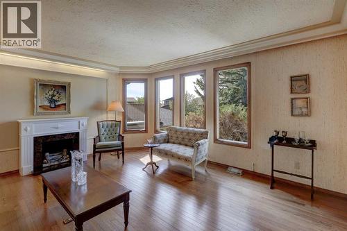 76 Edgeland Road Nw, Calgary, AB - Indoor Photo Showing Living Room With Fireplace