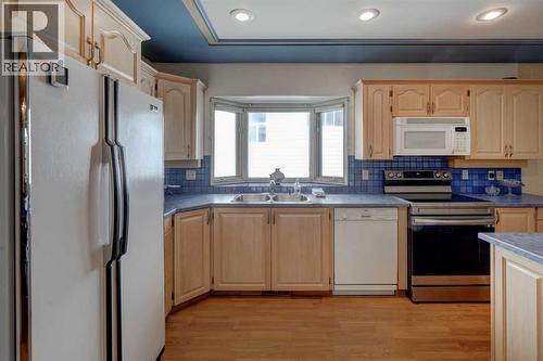 76 Edgeland Road Nw, Calgary, AB - Indoor Photo Showing Kitchen With Double Sink