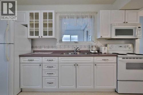 196 W 100 S, Raymond, AB - Indoor Photo Showing Kitchen With Double Sink