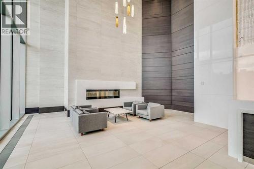 602, 930 16 Avenue Sw, Calgary, AB - Indoor Photo Showing Other Room With Fireplace