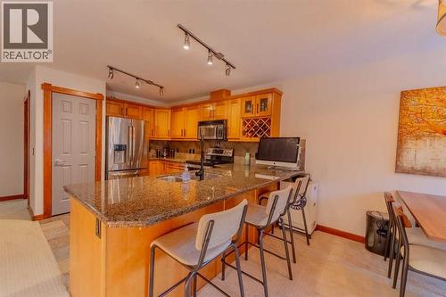313, 170 Crossbow Place, Canmore, AB - Indoor Photo Showing Kitchen With Double Sink