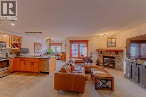 313, 170 Crossbow Place, Canmore, AB - Indoor With Fireplace