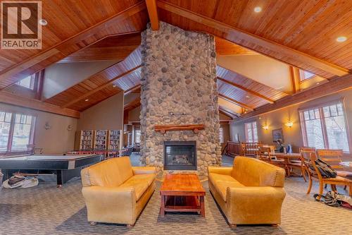 313, 170 Crossbow Place, Canmore, AB - Indoor With Fireplace