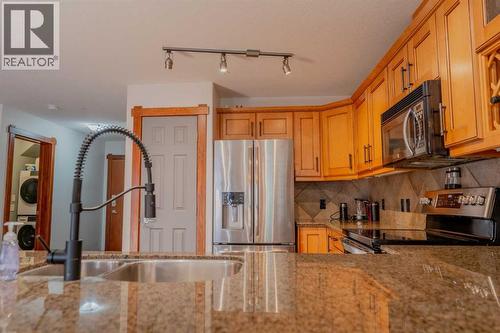 313, 170 Crossbow Place, Canmore, AB - Indoor Photo Showing Kitchen With Double Sink