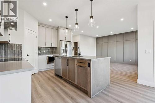 120 Quartz Crescent, Cochrane, AB - Indoor Photo Showing Kitchen With Upgraded Kitchen