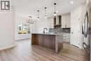 120 Quartz Crescent, Cochrane, AB  - Indoor Photo Showing Kitchen With Upgraded Kitchen 