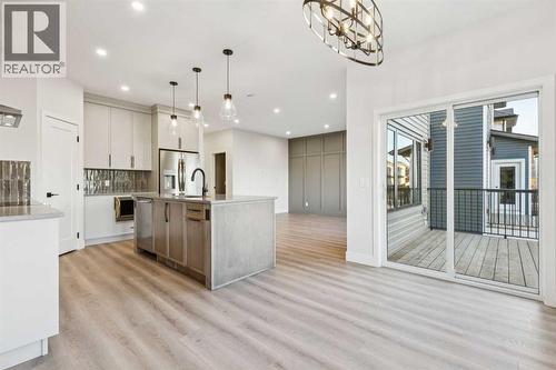 120 Quartz Crescent, Cochrane, AB - Indoor Photo Showing Kitchen With Upgraded Kitchen