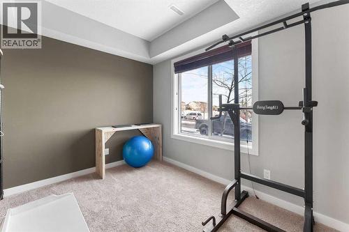 39 Silverado Way Sw, Calgary, AB - Indoor Photo Showing Gym Room