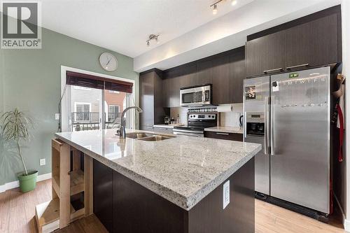 39 Silverado Way Sw, Calgary, AB - Indoor Photo Showing Kitchen With Stainless Steel Kitchen With Double Sink With Upgraded Kitchen