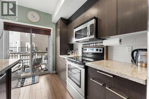 39 Silverado Way Sw, Calgary, AB - Indoor Photo Showing Kitchen With Upgraded Kitchen