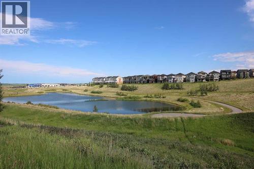 Across from Ravine & Pond - 27 Nolanlake Point Nw, Calgary, AB - Outdoor With Body Of Water With View