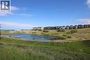 Across from Ravine & Pond - 27 Nolanlake Point Nw, Calgary, AB  - Outdoor With Body Of Water With View 