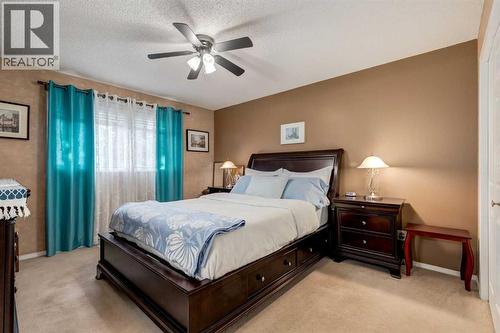 35 Woodstock Road Sw, Calgary, AB - Indoor Photo Showing Bedroom
