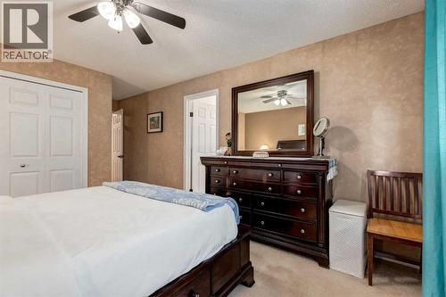 35 Woodstock Road Sw, Calgary, AB - Indoor Photo Showing Bedroom