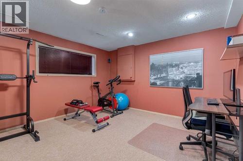 35 Woodstock Road Sw, Calgary, AB - Indoor Photo Showing Gym Room