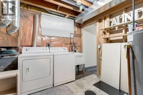 35 Woodstock Road Sw, Calgary, AB - Indoor Photo Showing Laundry Room