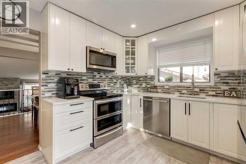 35 Woodstock Road Sw, Calgary, AB - Indoor Photo Showing Kitchen With Stainless Steel Kitchen With Upgraded Kitchen