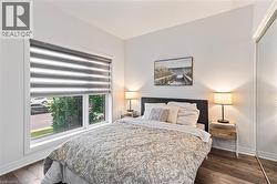 Bedroom with wood finished floors - 