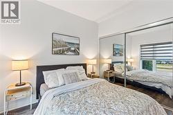 Bedroom with wood finished floors - 