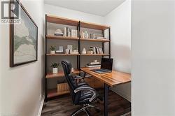 Office area featuring wood finished floors and baseboards - 