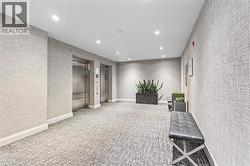 Corridor featuring elevator, recessed lighting, and carpet flooring - 